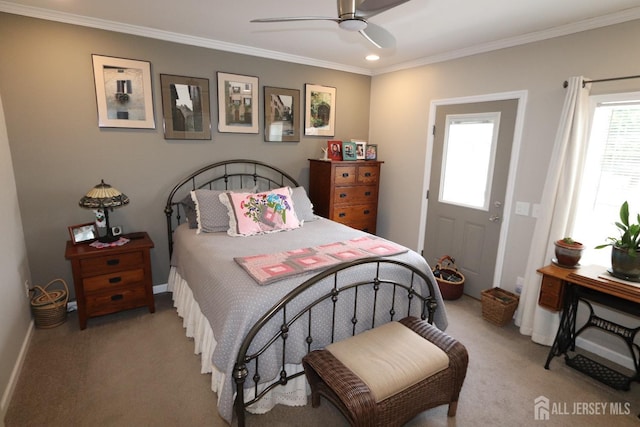 bedroom featuring baseboards, carpet, ornamental molding, and a ceiling fan