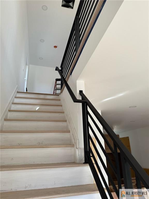 374 Oak St, Perth Amboy, NJ 08861 - stairway with wood finished floors