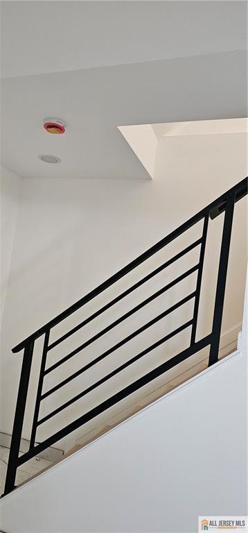 staircase featuring radiator heating unit