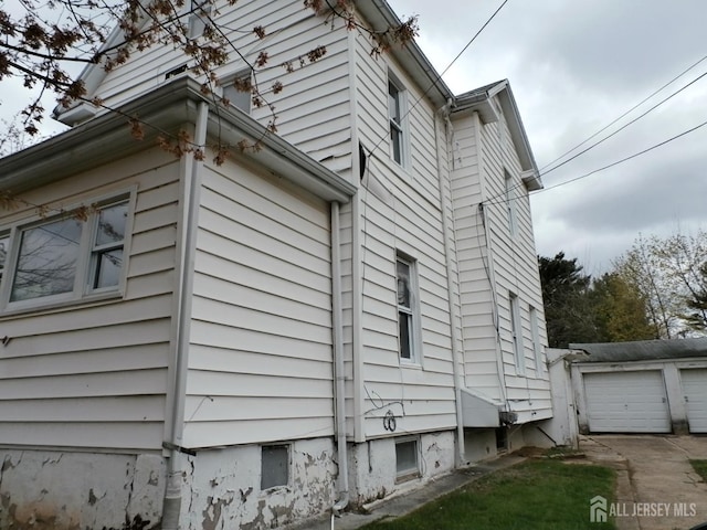 view of side of home featuring a garage