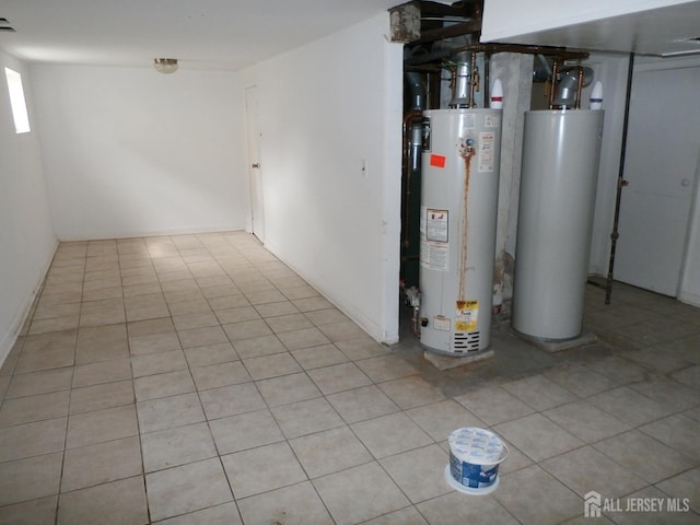 below grade area with tile patterned floors and gas water heater
