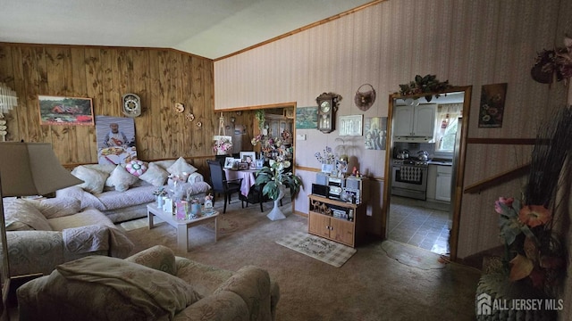 living room with carpet floors, lofted ceiling, and wood walls