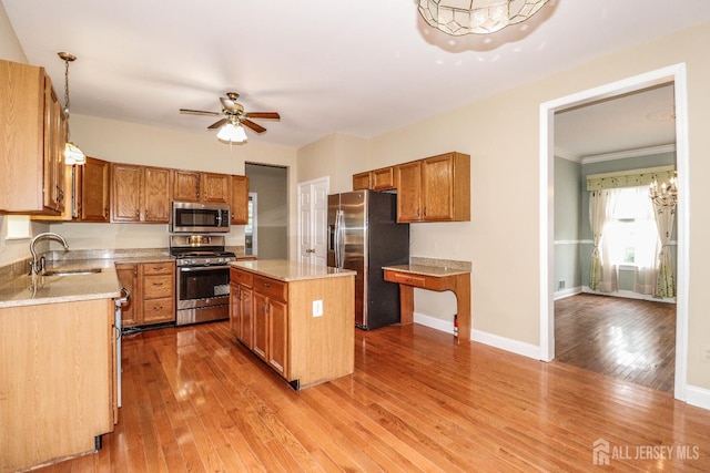 8 Staudt Ct, Franklin, NJ 08873 - kitchen with appliances with stainless steel finishes, wood finished floors, light countertops, ceiling fan, and brown cabinetry