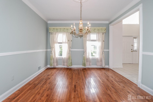 8 Staudt Ct, Franklin, NJ 08873 - unfurnished dining area featuring a chandelier, wood-type flooring, and ornamental molding
