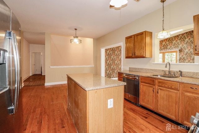 8 Staudt Ct, Franklin, NJ 08873 - kitchen with stainless steel appliances, a kitchen island, wood finished floors, and hanging light fixtures