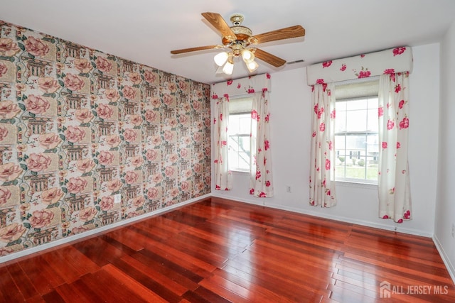 8 Staudt Ct, Franklin, NJ 08873 - spare room featuring wood finished floors, healthy amount of natural light, wallpapered walls, and ceiling fan