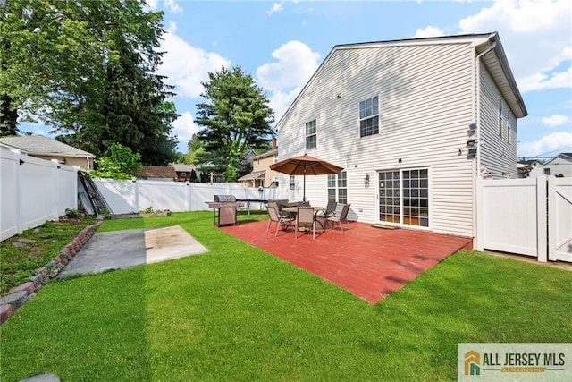 19 Edgegrove St, Edison, NJ 08837 - back of property with a fenced backyard, a patio area, and a deck