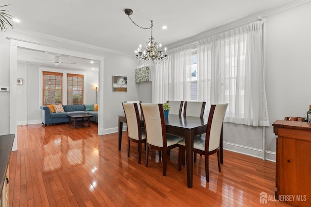 307 S 4th Ave, Highland Park, NJ 08904 - dining space with baseboards, hardwood / wood-style floors, ornamental molding, a chandelier, and recessed lighting
