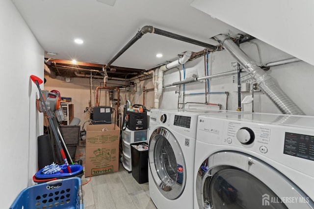 307 S 4th Ave, Highland Park, NJ 08904 - clothes washing area with independent washer and dryer and wood finished floors