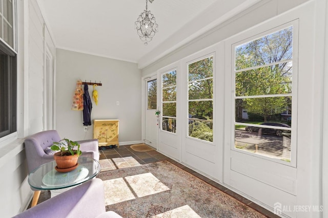 307 S 4th Ave, Highland Park, NJ 08904 - doorway to outside featuring healthy amount of natural light, stone tile floors, a chandelier, and baseboards
