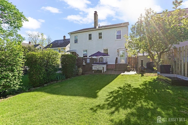 307 S 4th Ave, Highland Park, NJ 08904 - rear view of house featuring a chimney