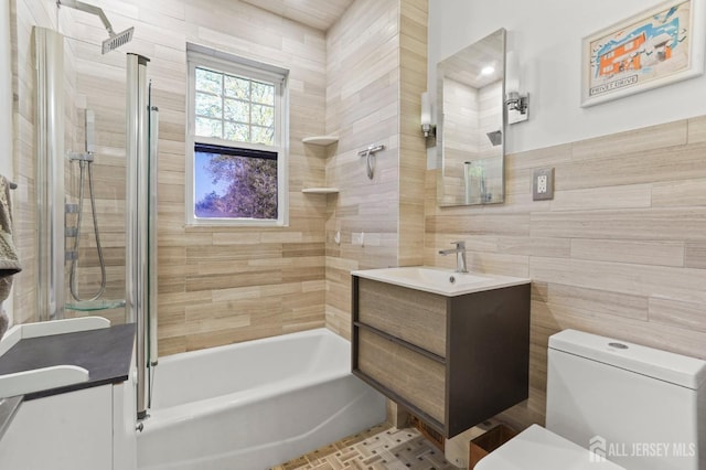307 S 4th Ave, Highland Park, NJ 08904 - bathroom featuring tile walls, vanity, and toilet
