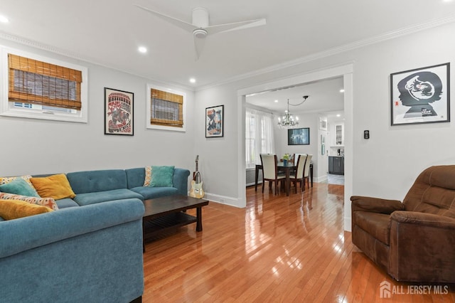 307 S 4th Ave, Highland Park, NJ 08904 - living room featuring a chandelier, ornamental molding, recessed lighting, light wood-style flooring, and baseboards