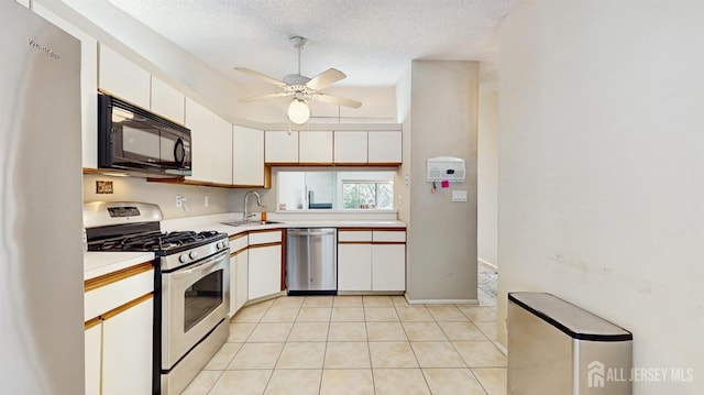 234 Wycoff Way E, Brunswick, NJ 08816 - kitchen featuring appliances with stainless steel finishes, light countertops, a sink, a ceiling fan, and white cabinetry