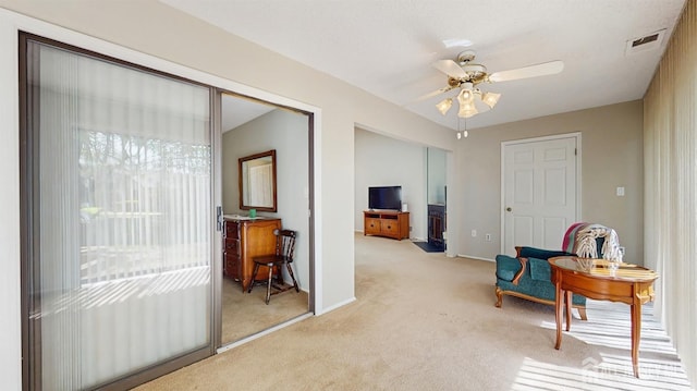 234 Wycoff Way E, Brunswick, NJ 08816 - sitting room with light colored carpet, ceiling fan, and baseboards