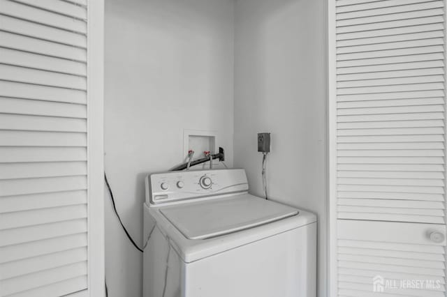 laundry room featuring laundry area and washer / clothes dryer