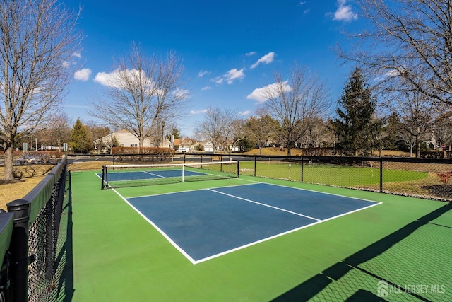 view of sport court with fence