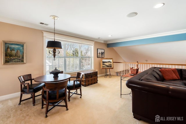 dining area with baseboards, visible vents, crown molding, and light colored carpet