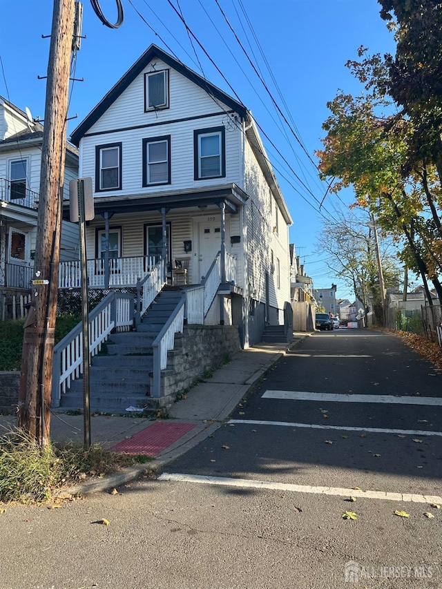 view of front of property featuring covered porch