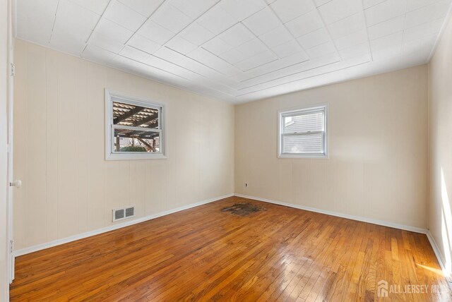 spare room featuring hardwood / wood-style floors