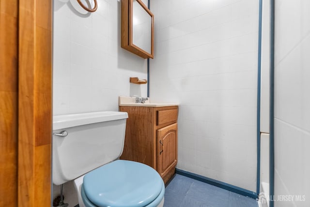 bathroom with vanity and toilet