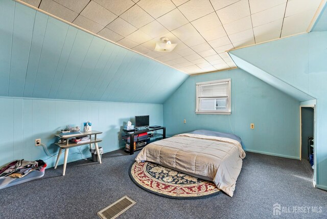 carpeted bedroom featuring lofted ceiling