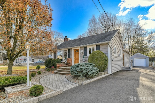 view of front of property with an outbuilding and a garage