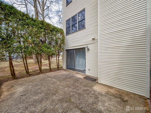 exterior space with a patio and driveway