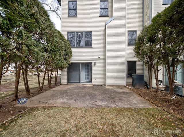 exterior space with a patio area and central AC unit