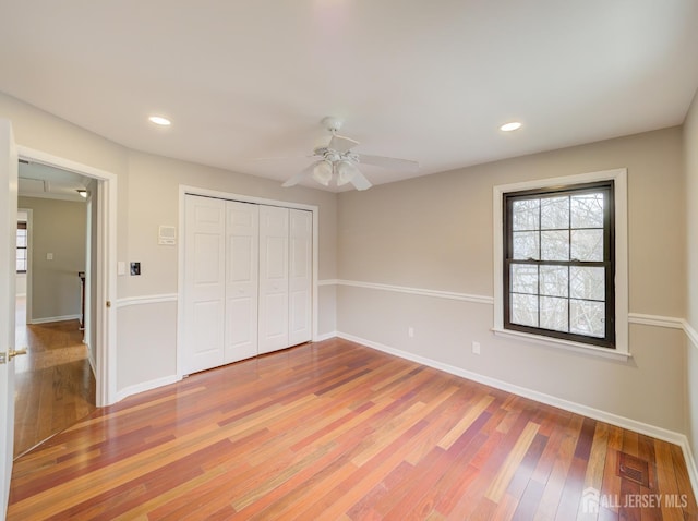 unfurnished bedroom featuring recessed lighting, visible vents, baseboards, and wood finished floors