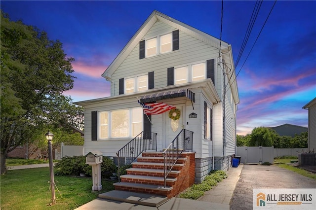 6 Hermann St, Carteret, NJ 07008 - view of front facade featuring central air condition unit and a gate