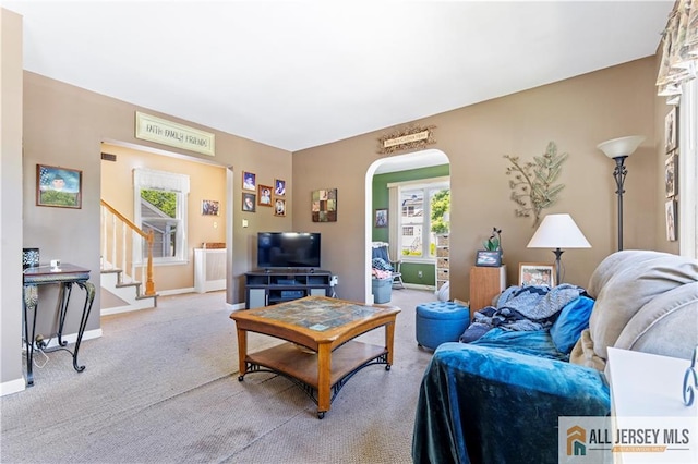 6 Hermann St, Carteret, NJ 07008 - living room with arched walkways, carpet floors, baseboards, and stairs