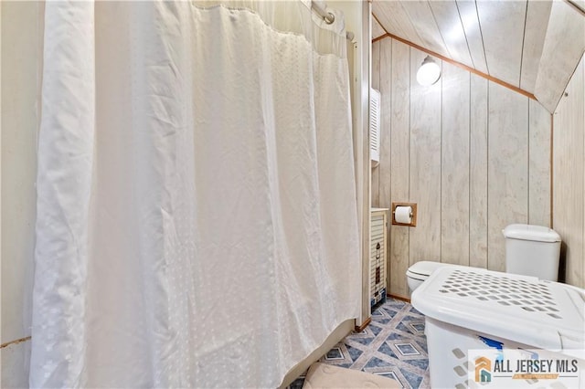 6 Hermann St, Carteret, NJ 07008 - bathroom featuring toilet, wooden walls, and a shower with shower curtain