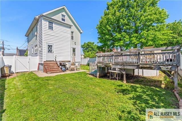 6 Hermann St, Carteret, NJ 07008 - rear view of property featuring entry steps, a gate, and a patio