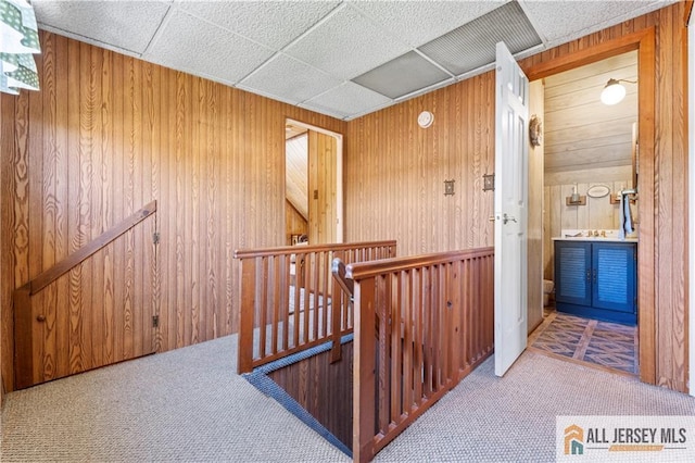 6 Hermann St, Carteret, NJ 07008 - hallway featuring an upstairs landing, carpet, and wood walls