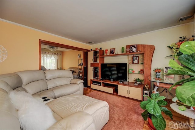 living area featuring light carpet, visible vents, and ornamental molding