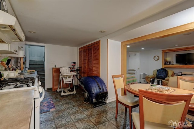 dining room with recessed lighting, stairway, and baseboards