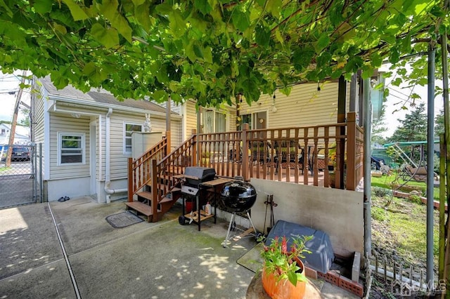 view of patio featuring grilling area and a deck