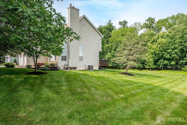 36 Jared Blvd, South Brunswick, NJ 08824 - view of property exterior with a chimney and a lawn