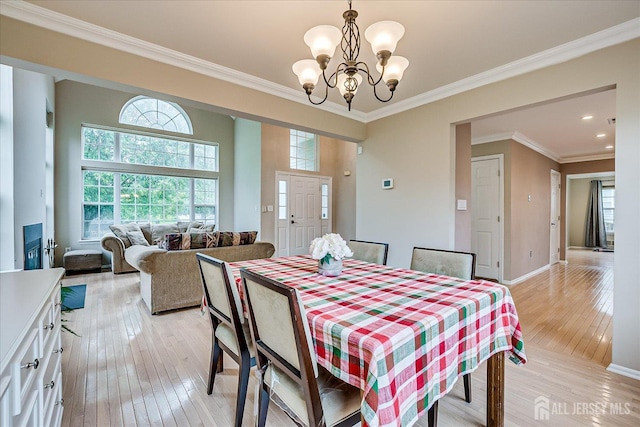 36 Jared Blvd, South Brunswick, NJ 08824 - dining space with light wood-type flooring, a chandelier, plenty of natural light, crown molding, and recessed lighting