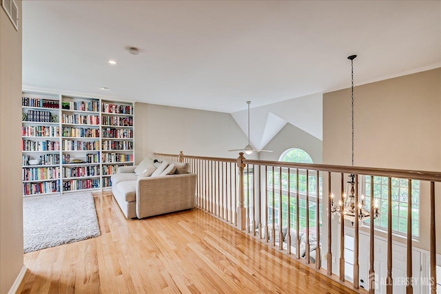 36 Jared Blvd, South Brunswick, NJ 08824 - sitting room with wood finished floors, ceiling fan, a chandelier, and lofted ceiling