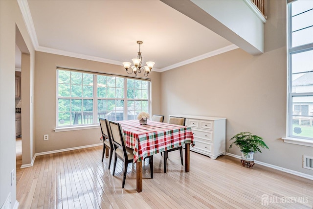 36 Jared Blvd, South Brunswick, NJ 08824 - dining area featuring a chandelier, light wood-style floors, healthy amount of natural light, and crown molding