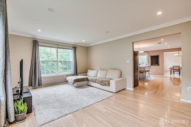 36 Jared Blvd, South Brunswick, NJ 08824 - living area with light wood-type flooring, plenty of natural light, a chandelier, ornamental molding, and recessed lighting