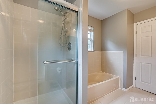 36 Jared Blvd, South Brunswick, NJ 08824 - full bath with a shower stall, a garden tub, and tile patterned flooring
