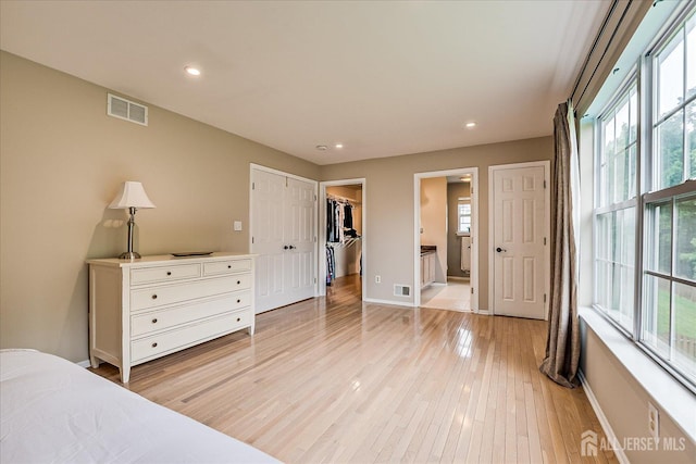 36 Jared Blvd, South Brunswick, NJ 08824 - bedroom with multiple windows, light wood-type flooring, recessed lighting, and a walk in closet