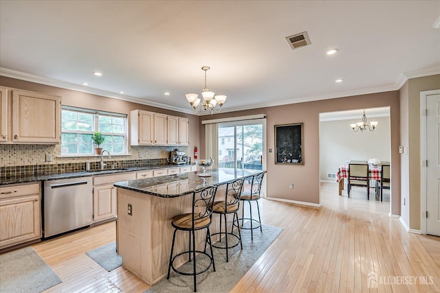36 Jared Blvd, South Brunswick, NJ 08824 - kitchen featuring stainless steel dishwasher, a chandelier, light brown cabinets, healthy amount of natural light, and crown molding
