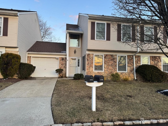 view of front of home with a garage and a front yard