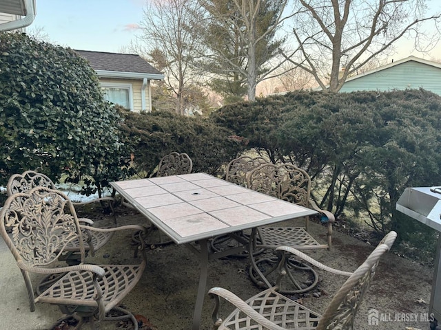 view of patio featuring outdoor dining area