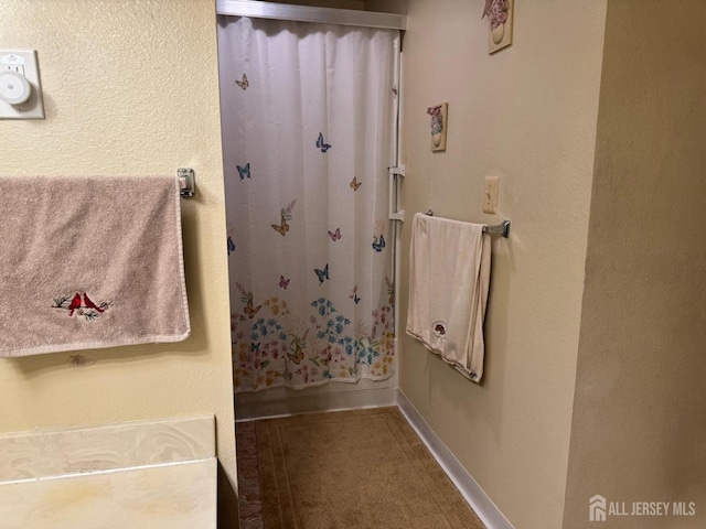 bathroom featuring baseboards