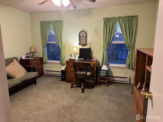 office space featuring baseboard heating, carpet flooring, and a textured ceiling